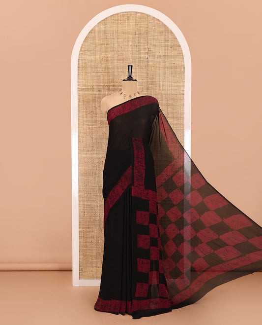 Black and purple plain georgette saree, batik printed border, batik printed checked pallu, and a matching blouse