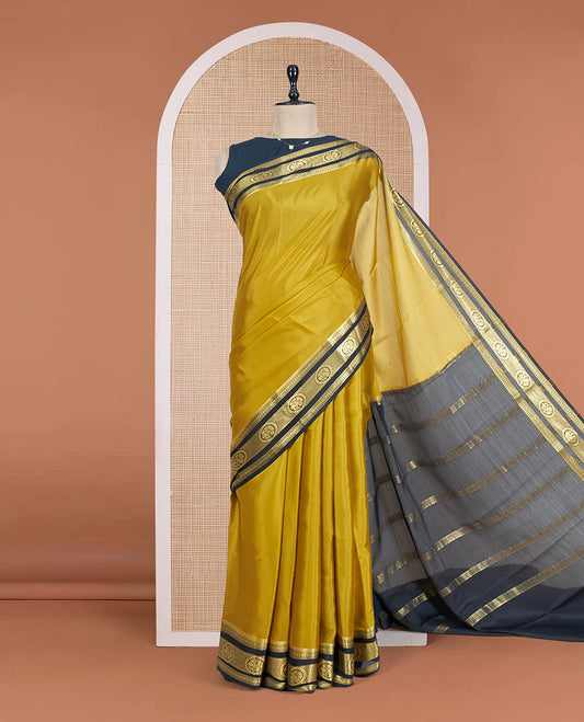 Mustrad Plain Mysore Silk Saree, Complemented by a Contrast Traditional Zari Design Border, a Pallu Gleamed Up with Zari Stripes, and a Contrast Blouse