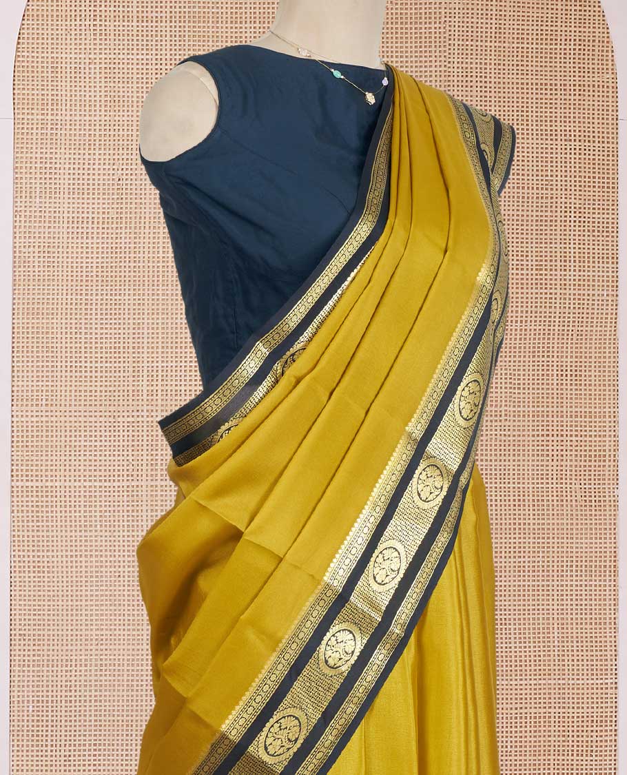 Mustrad Plain Mysore Silk Saree, Complemented by a Contrast Traditional Zari Design Border, a Pallu Gleamed Up with Zari Stripes, and a Contrast Blouse
