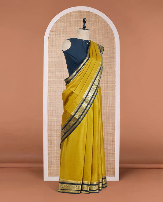 Mustrad Plain Mysore Silk Saree, Complemented by a Contrast Traditional Zari Design Border, a Pallu Gleamed Up with Zari Stripes, and a Contrast Blouse