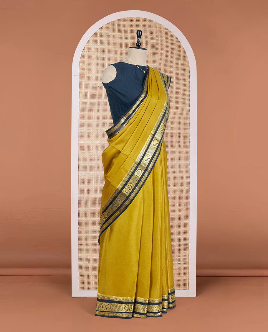 Mustrad Plain Mysore Silk Saree, Complemented by a Contrast Traditional Zari Design Border, a Pallu Gleamed Up with Zari Stripes, and a Contrast Blouse