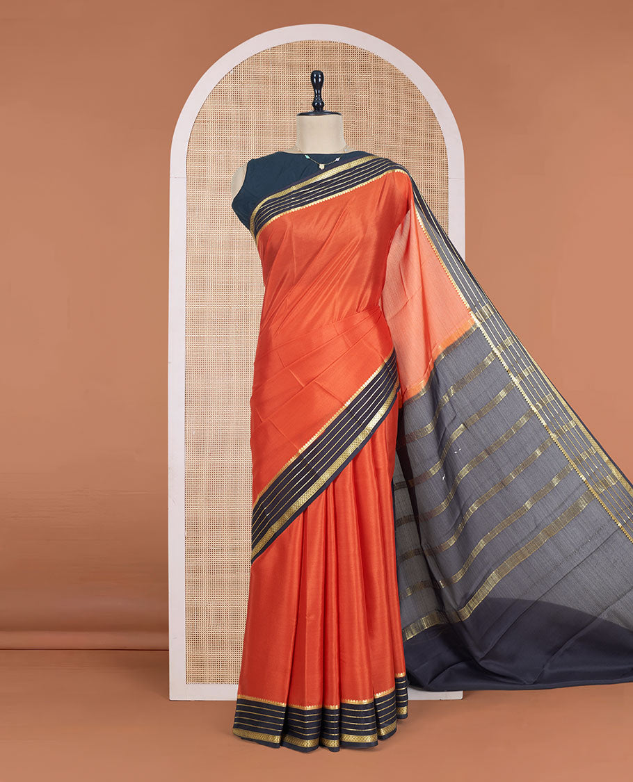 Orange Plain Mysore Silk Saree, Complemented by a Contrast Varisai Pettu Border of Traditional Zari Designs, a Subtly Sparkled Pallu of Zari Stripes, and a Contrast Blouse
