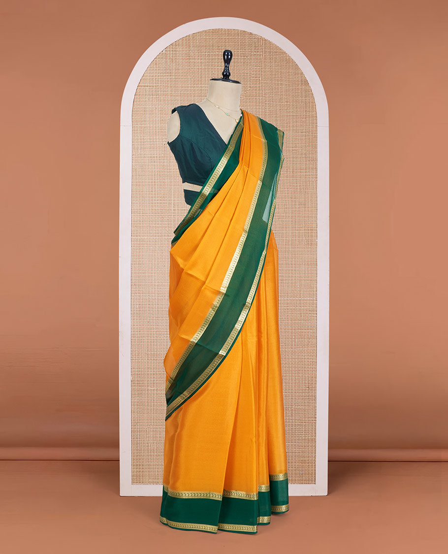 Orange Plain Mysore Silk Saree, Complemented by a Contrast Rettai Pettu Border of Paisley Designs, Pallu Mirrors the Same Border Motifs, and a Contrast Blouse
