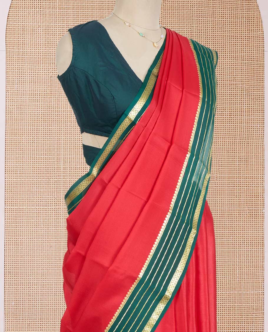 Red Plain Mysore Silk Saree, Complemented by a Contrast Varisai Pettu Border of Traditional Zari Designs, a Subtly Sparkled Pallu of Zari Stripes, and a Contrast Blouse