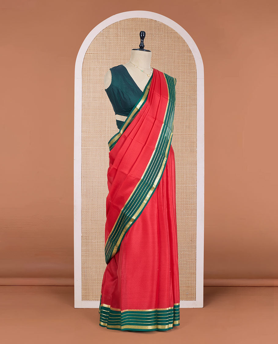 Red Plain Mysore Silk Saree, Complemented by a Contrast Varisai Pettu Border of Traditional Zari Designs, a Subtly Sparkled Pallu of Zari Stripes, and a Contrast Blouse