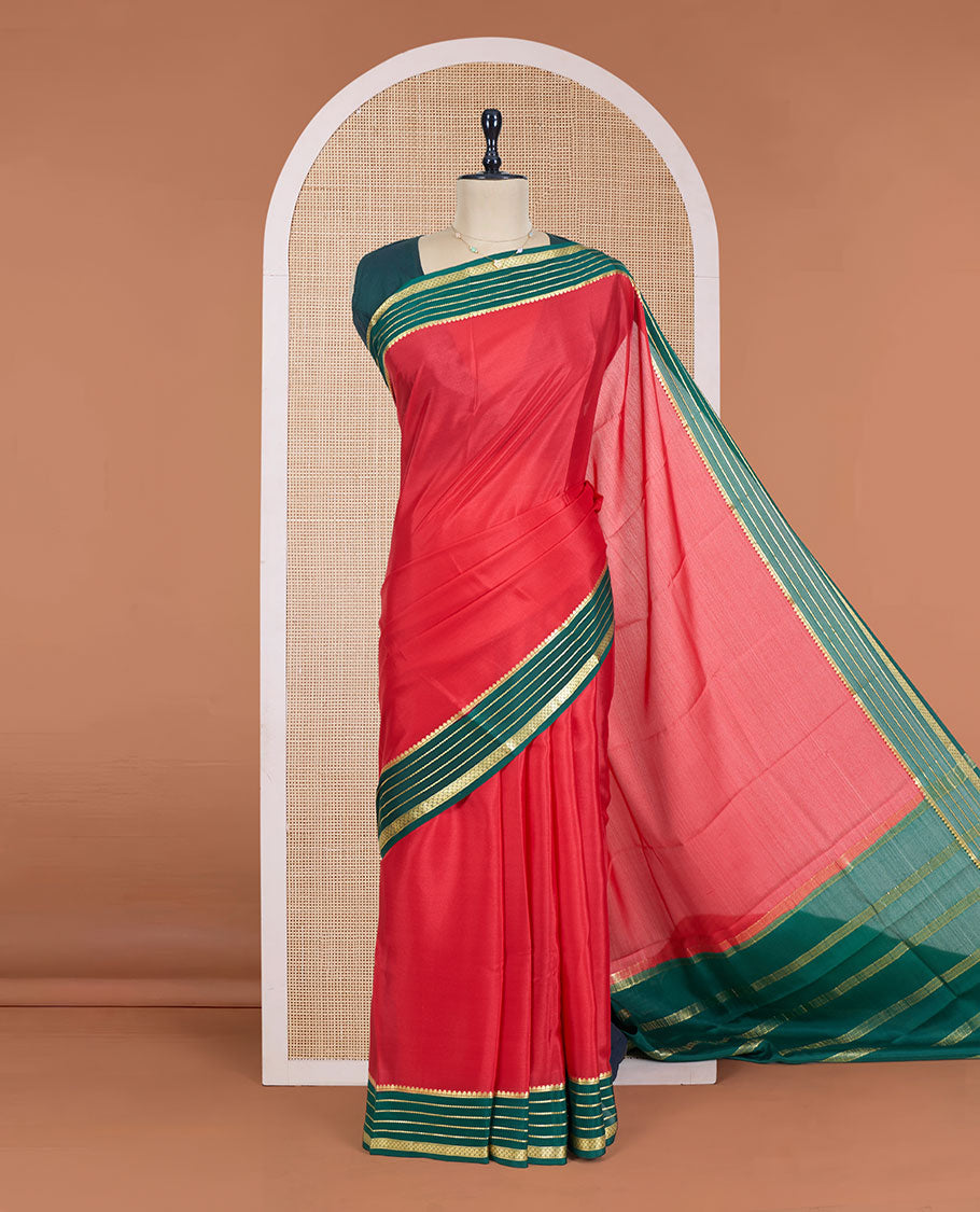 Red Plain Mysore Silk Saree, Complemented by a Contrast Varisai Pettu Border of Traditional Zari Designs, a Subtly Sparkled Pallu of Zari Stripes, and a Contrast Blouse