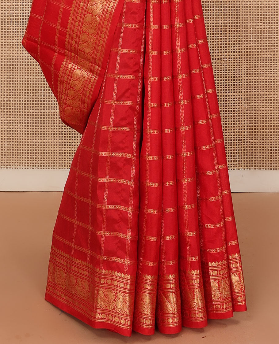 Dazzling red thick zari checked Kanchipuram silk saree, zari border of thilakam mokku, rudraksham, and Mayil, and contrast gleaming zari seer pallu