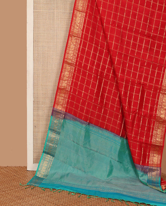 Dazzling red thick zari checked Kanchipuram silk saree, zari border of thilakam mokku, rudraksham, and Mayil, and contrast gleaming zari seer pallu