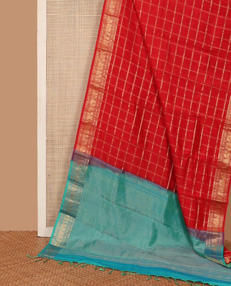Dazzling red thick zari checked Kanchipuram silk saree, zari border of thilakam mokku, rudraksham, and Mayil, and contrast gleaming zari seer pallu