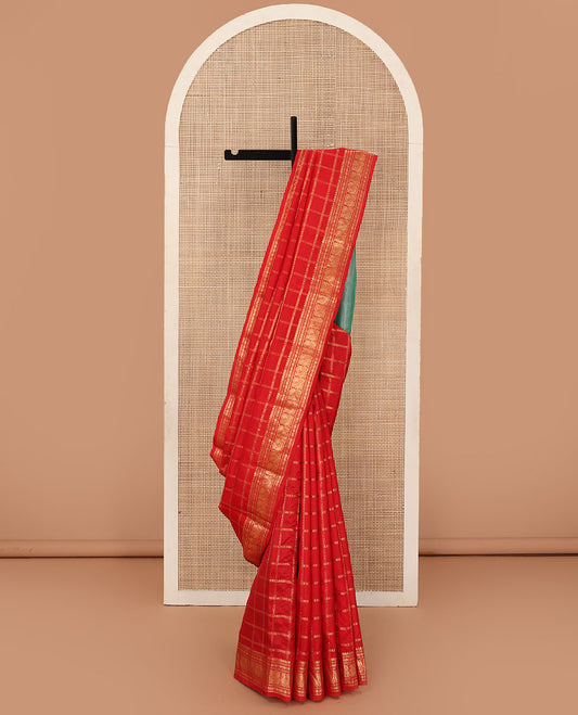 Dazzling red thick zari checked Kanchipuram silk saree, zari border of thilakam mokku, rudraksham, and Mayil, and contrast gleaming zari seer pallu
