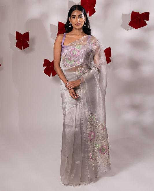 Scintillating grey floral embroidered with golden outlined organza saree, scallop border, and floral embroidered pallu