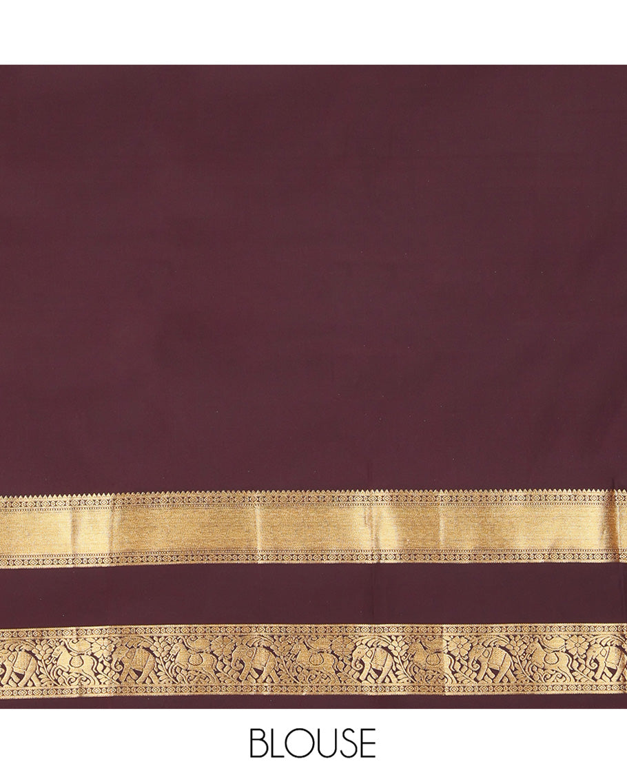 Green Budget Silk Saree, Delicately Woven with Zari Stripes and Kolam Buttas All Over Its Body, Complemented by a Contrast Traditional Zari Design Rettai Pettu Border, Grand Scallop Design Pallu, and Paired with a Contrast Blouse
