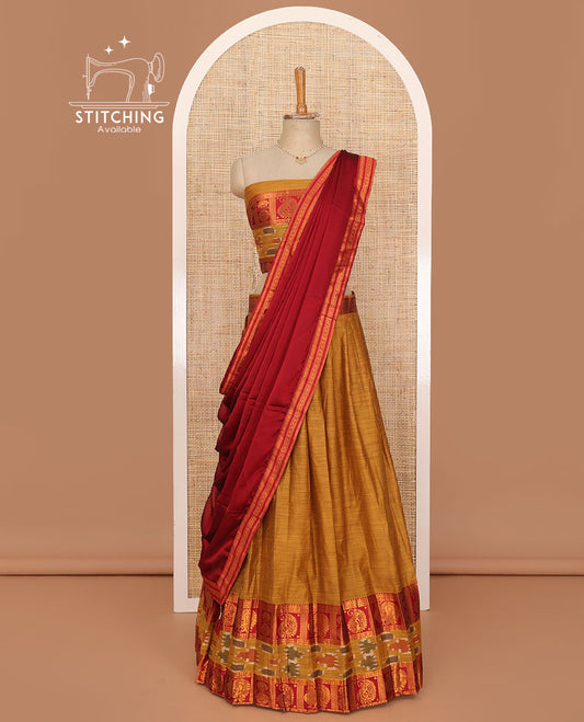 Honey orange lehenga set, plain with contrast manga zari and ikkat border skirt, matching blouse and contrast zari border plain dhavani