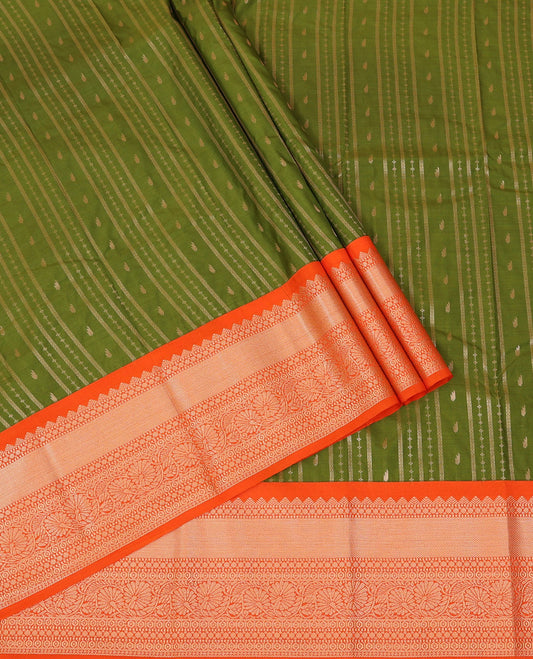 Green Art Silk Pavadai Material Set, Detailed with Zari Designs All Over Its Skirt, Highlighted with a Contrast Traditional Zari Design Border, and Paired with a Contrast Blouse