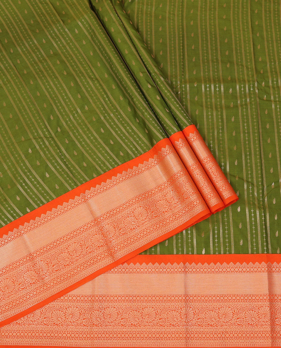 Green Art Silk Pavadai Material Set, Detailed with Zari Designs All Over Its Skirt, Highlighted with a Contrast Traditional Zari Design Border, and Paired with a Contrast Blouse