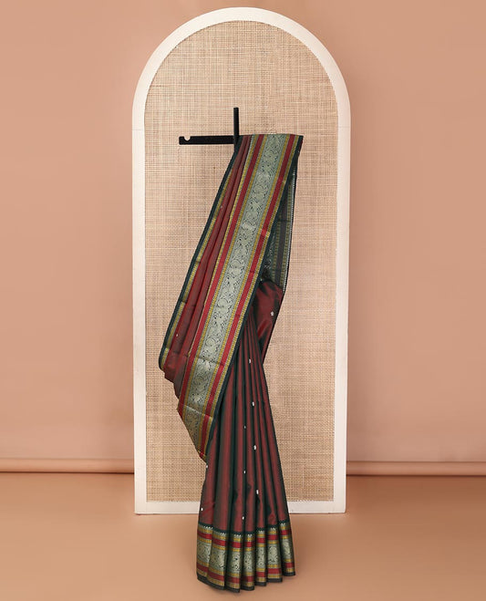 Maroon mayil chakram thread buttas Kanchipuram silk saree, contrast border of thilakam mokku, mayil, yaali, and rudraksham, and pallu of big Nava Nari Kunjara motif