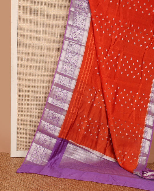 Dark orange meena buttas raw mango silk saree, contrast traditional zari border of floral creeper, and jaal pallu