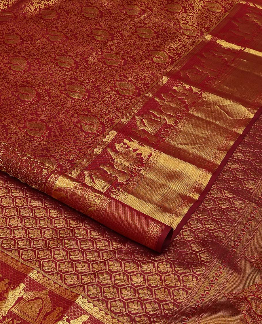 Maroon jacquard wedding silk saree, traditional zari border of wedding palanquin design, and butta enclosed hexogon grid pallu