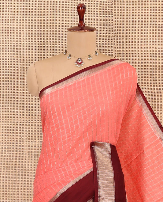Peach Assam Silk Saree Subtly Sparkled with Micro-Checks, Complemented by Captivating Contrast Zari-Decked Up Border, Gleaming Zari-Woven Pallu, and Paired with a Contrast Blouse