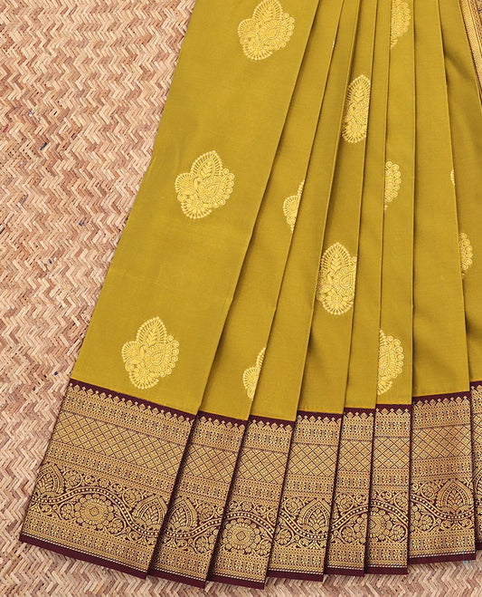 Green Budget Silk Saree, Gleamed Up with Zari Buttas All Over Its Body, Complemented by a Contrast Border of Traditional Motifs in Zari, Pallu Woven with Jaal Design, and Paired with a Contrast Blouse
