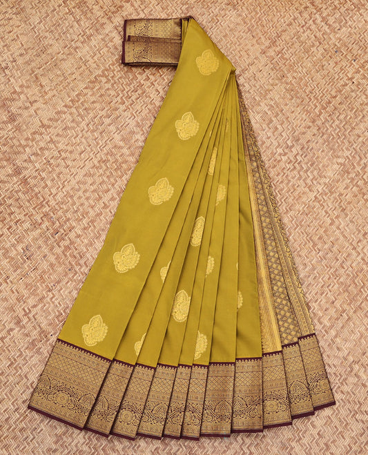 Green Budget Silk Saree, Gleamed Up with Zari Buttas All Over Its Body, Complemented by a Contrast Border of Traditional Motifs in Zari, Pallu Woven with Jaal Design, and Paired with a Contrast Blouse