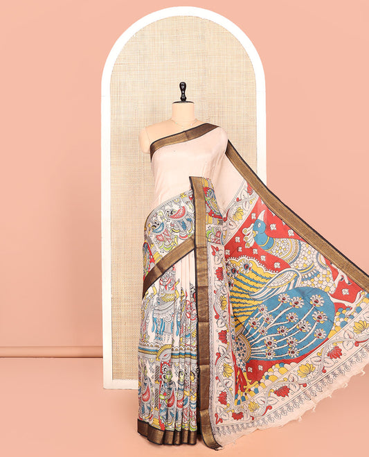 Light Sandal Kalamkari Cotton Saree, Graced with Human Figurine Print, Contrast Traditional Zari Border, Peacock Pallu, and a Contrast Blouse