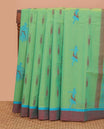 Green buttas Kanchi cotton saree, contrast plain border, and pallu of human figurines