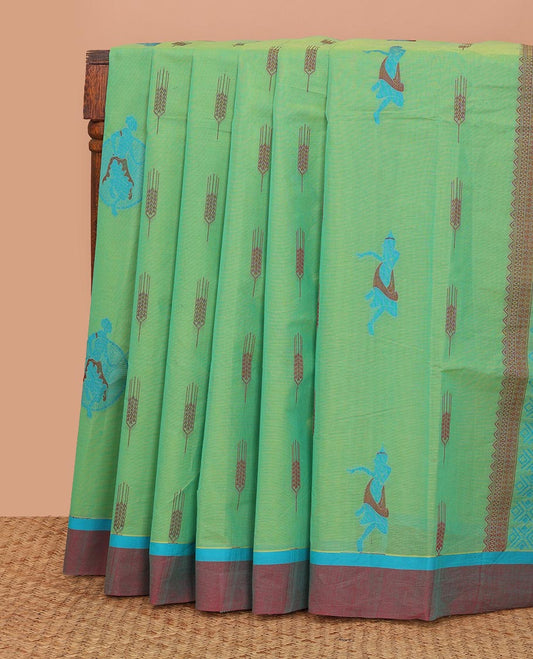 Green buttas Kanchi cotton saree, contrast plain border, and pallu of human figurines