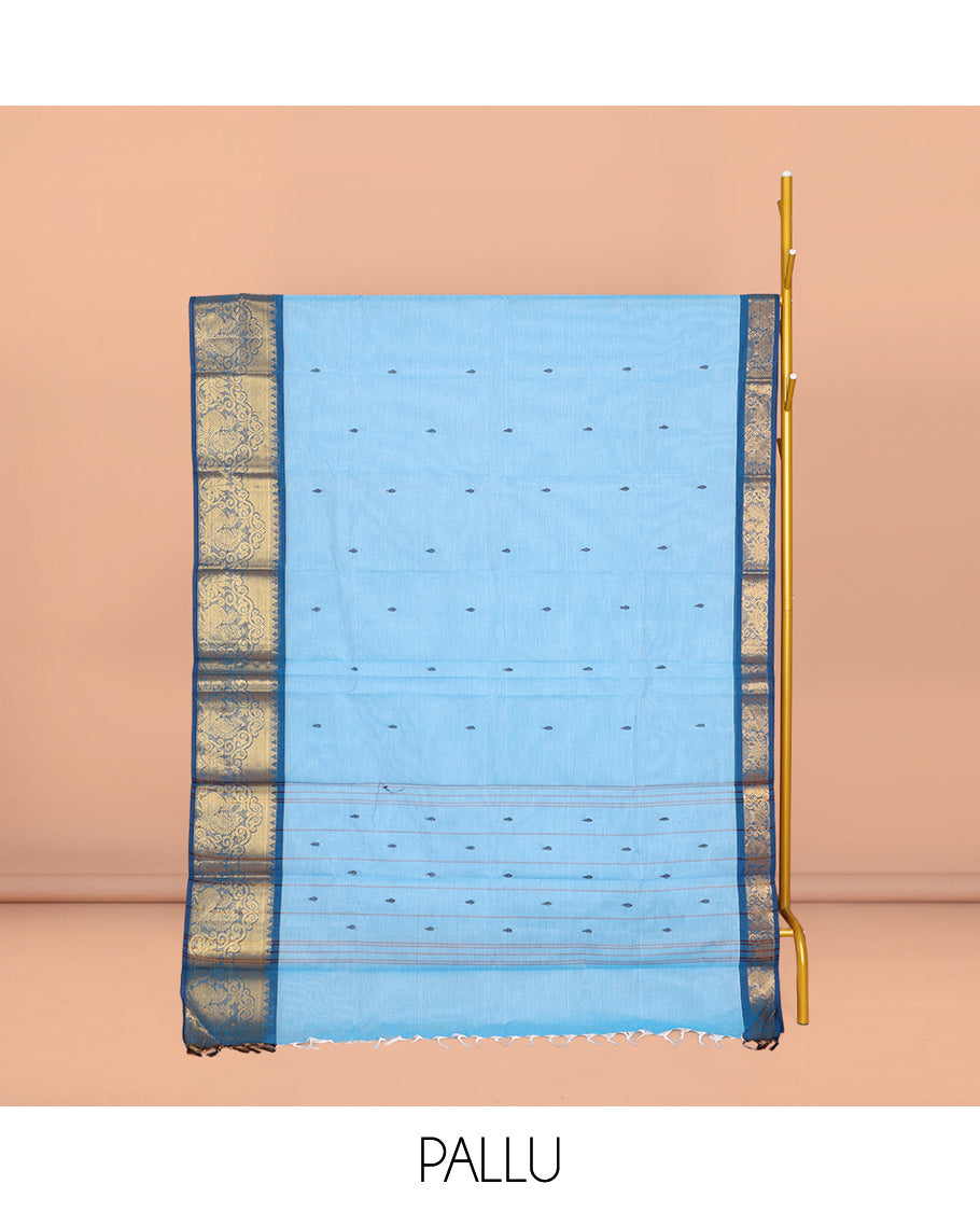 Blue Chettinad Cotton Saree, Subtly Sparkled with Buttas All Over Its Body, Complemented by a Contrast Peacock Zari Design Border, Pallu of Stripes and Buttas, and Paired with a Matching Blouse