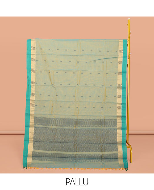 Green Kanchi Cotton Saree, Elevated with Buttas All Over Its Body, Complemented by a Contrast Border, Pallu of Intricate Design, and Paired with Matching Blouse