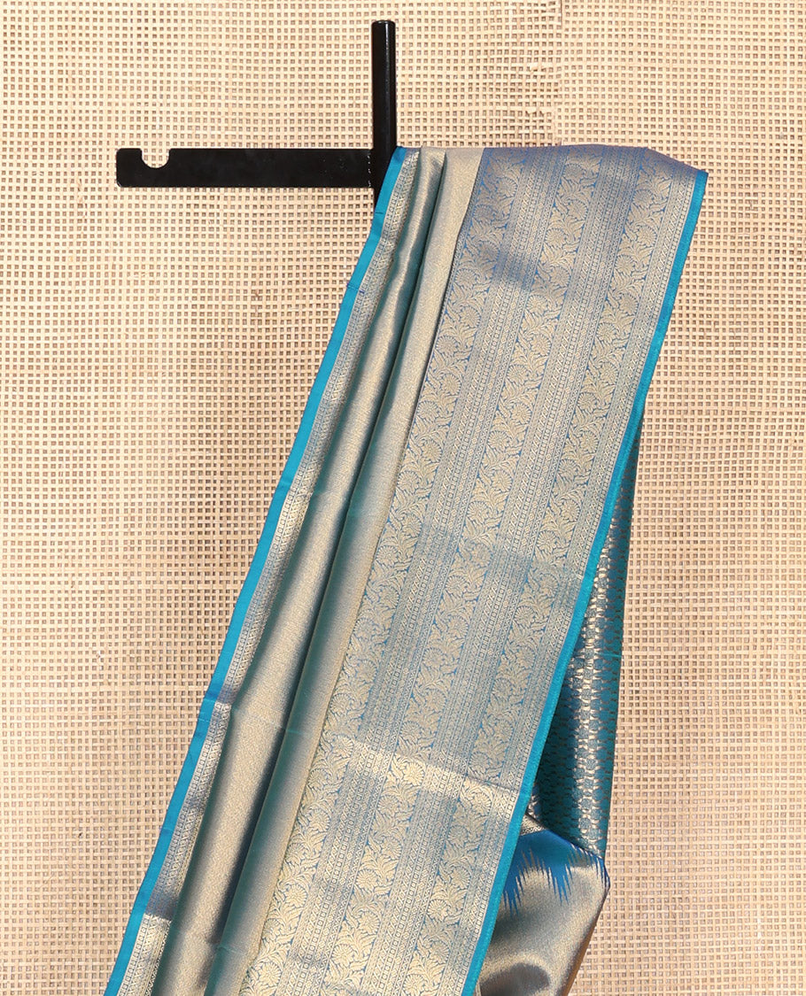 Scintillating Blue Vasundhara Lite-Silk Mix Saree, Gleamed Up with Zari on Its Body, Highlighted by Thazampoo Rekku Border of Neli, Paisa, Cross Kamalam, and Kodi Visiry Designs, a Grand Geometric-Patterned Pallu, and Paired with a Matching Blouse