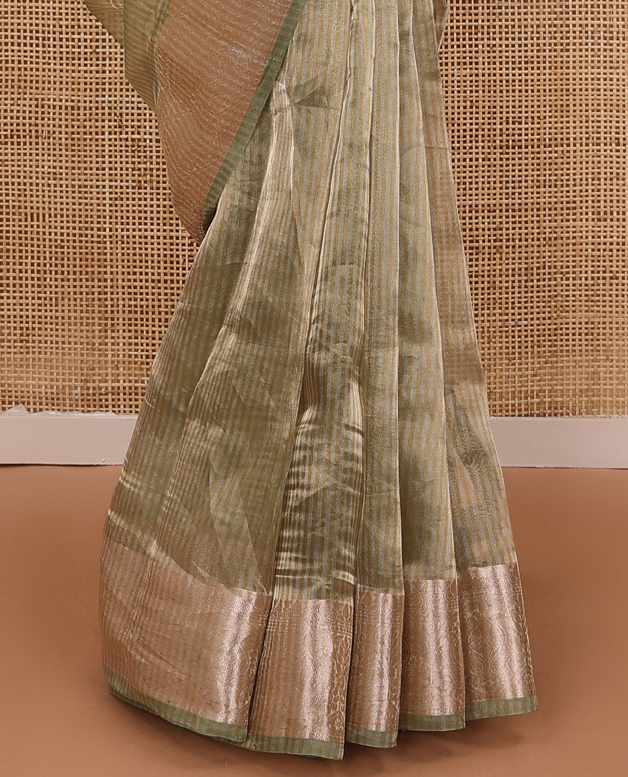 Pastel green sparesely striped tissue saree, Mughal style zari woven border, and intricately zari woven pallu