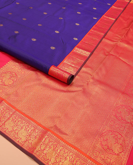 Blue mayil buttas Kanchipuram silk saree, contrast border of thilakam mokku, muthu, and mayil designs, and jaal pallu