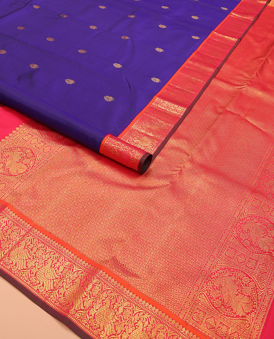 Blue mayil buttas Kanchipuram silk saree, contrast border of thilakam mokku, muthu, and mayil designs, and jaal pallu