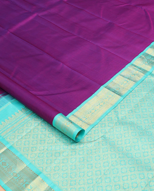 Purple plain Kanchipuram silk saree, contrast korvai border of thilakam mokku, muthu, vanki, lavangam, neli, diamond, and manga designs, and jaal pallu
