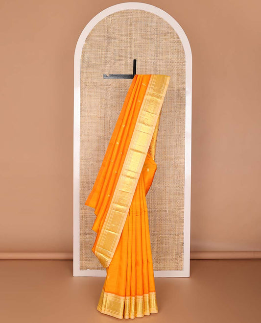 Orange buttas kancheepuram silk saree with contrast border of thilakam mokku, banaras, geometric design & floral pallu