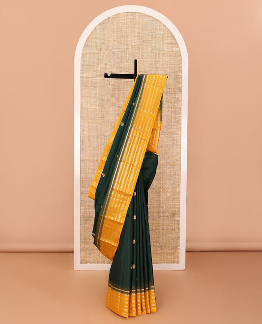 Green zari buttas silk saree, contrast border of muthu,dhavana kodi, laddu kamalam & diamond, & intricate pallu