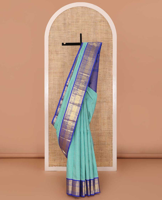 Blue micro-checked Kanchipuram silk saree, contrast korvai border of manga mokku,kathir,muthu,manga and mayil and jaal pallu
