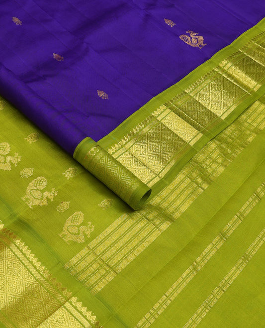 Blue zari buttas Kanchipuram silk saree, contrast one-sided border of thilakam mokku, banaras, and jaal designs, and pallu of mayil motifs