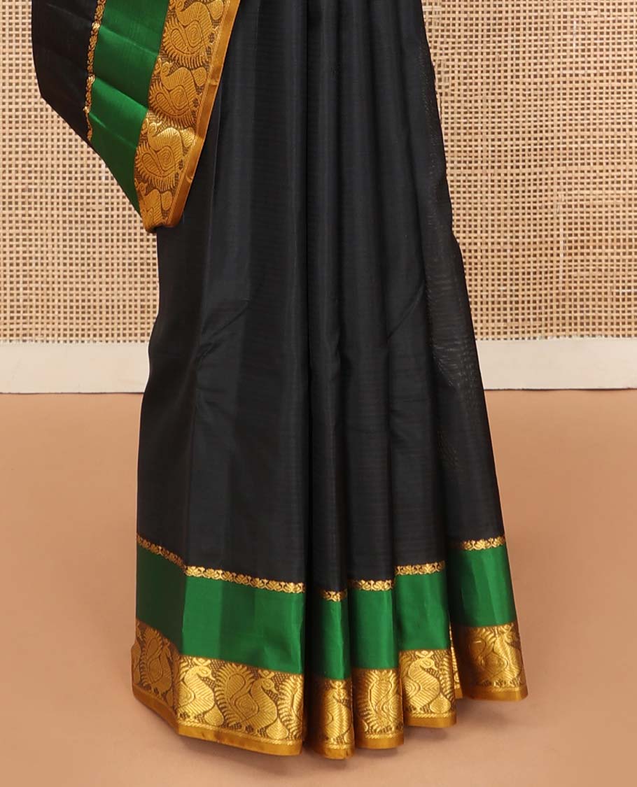 Black striped Kanchipuram silk saree, contrast rettai pettu border of salngai, and mayil designs, and pallu of stripes, and thazampoo rekku designs