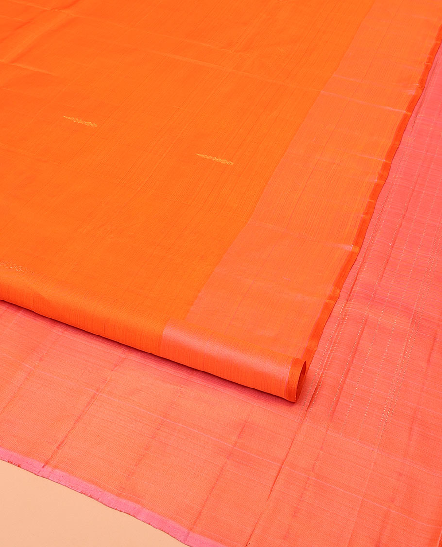 Orange Kanchipuram Silk Saree, Subtly Sparkled with Zari Buttas on Its Body, Complemented by a Contrast Border of Manga Designs, Pallu Steeped with Floral Designs, and Paired with a Contrast Blouse