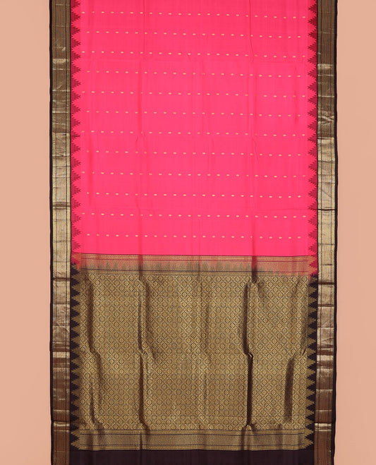 Pink nine-yard silksaree with zari buttas, contrast thazampoo reku border of ara bogudi, muthu & ara maadam & jaal pallu