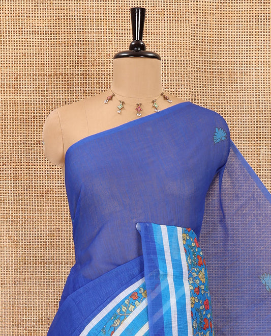 Blue floral motifs printed linen cotton saree with contrast kalamkari floral vine printed border, floral vine printed pallu, and a plain blouse