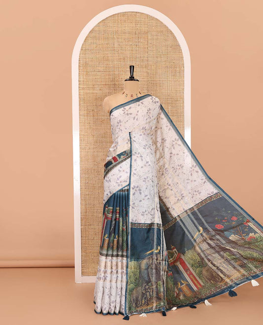 Blue floral, elephant, and ancient scenery printed Moss crush saree, piping border, elephant motif printed pallu, and contrast printed blouse