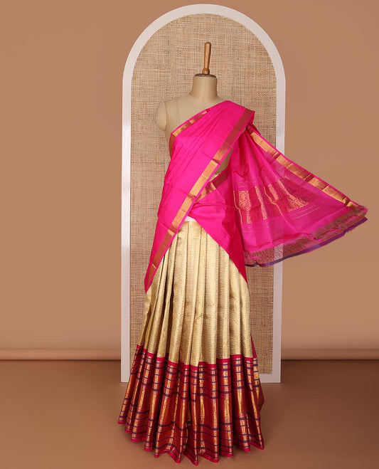 Gold striped silk half saree with contrast border of rekku, banaras, muthu, poo chakram, mayil design, zari design blouse & floral design dhavani
