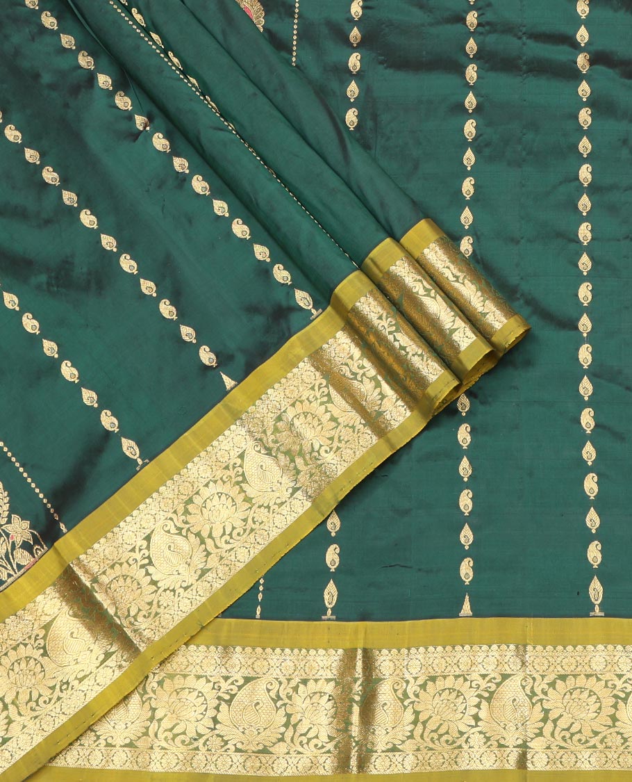 Green Pure Silk Half-Saree, Accentuated with Zari Buttas on Its Body, Complemented by a Contrast Floral and Paisley Design Border, Complemented by a Contrast Blouse, and Paired with a Contrast Dhavani of Jaal Designs
