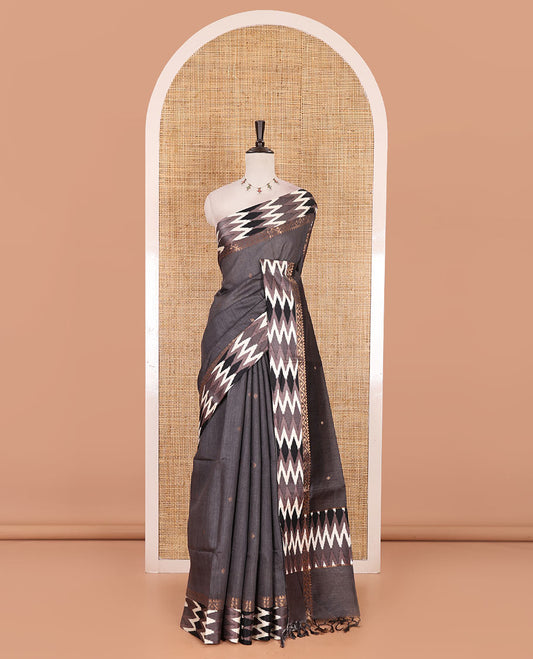 Grey buttas tussar silk saree, ikkat design border, and pallu of ikkat design