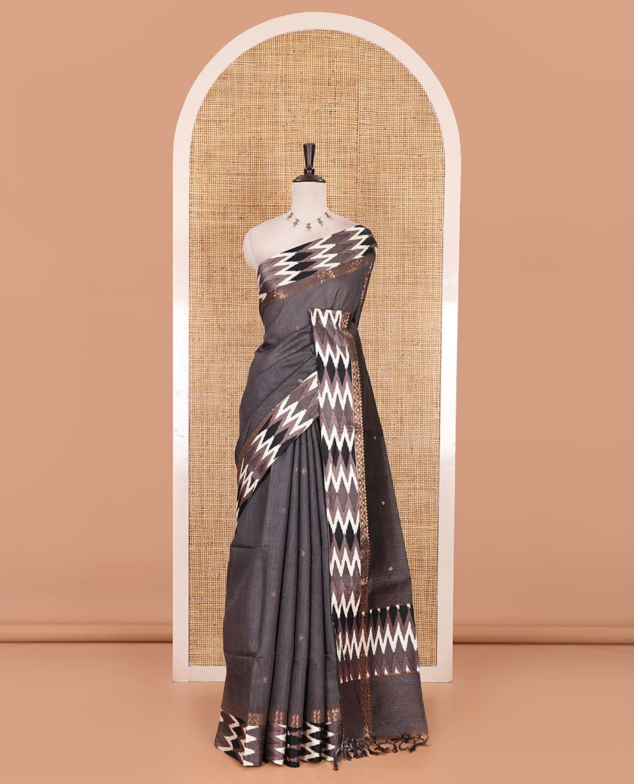 Grey buttas tussar silk saree, ikkat design border, and pallu of ikkat design