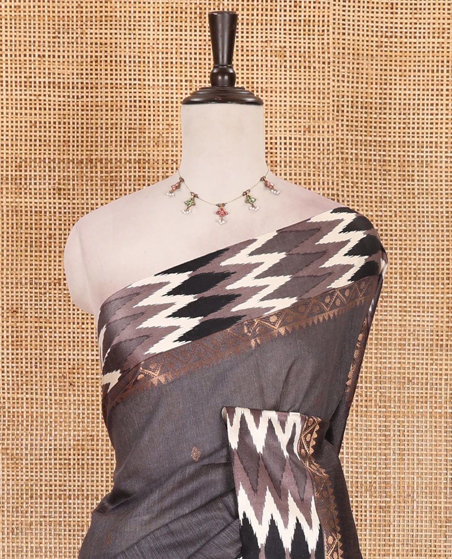 Grey buttas tussar silk saree, ikkat design border, and pallu of ikkat design