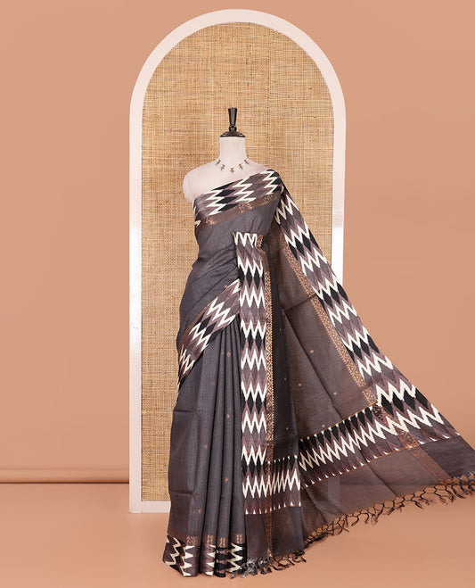 Grey buttas tussar silk saree, ikkat design border, and pallu of ikkat design